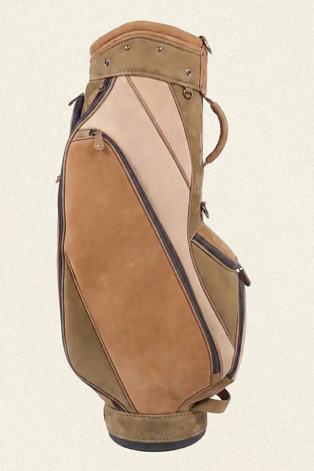 A tan and beige suede golf bag with dark brown trim, shown from a side profile view against a light cream background.