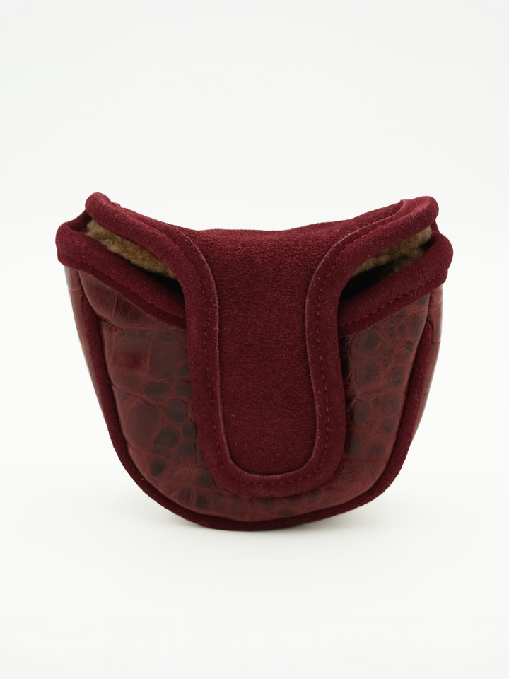 A burgundy fleece and crocodile-embossed leather pouch with a soft lining, photographed on a clean white background.