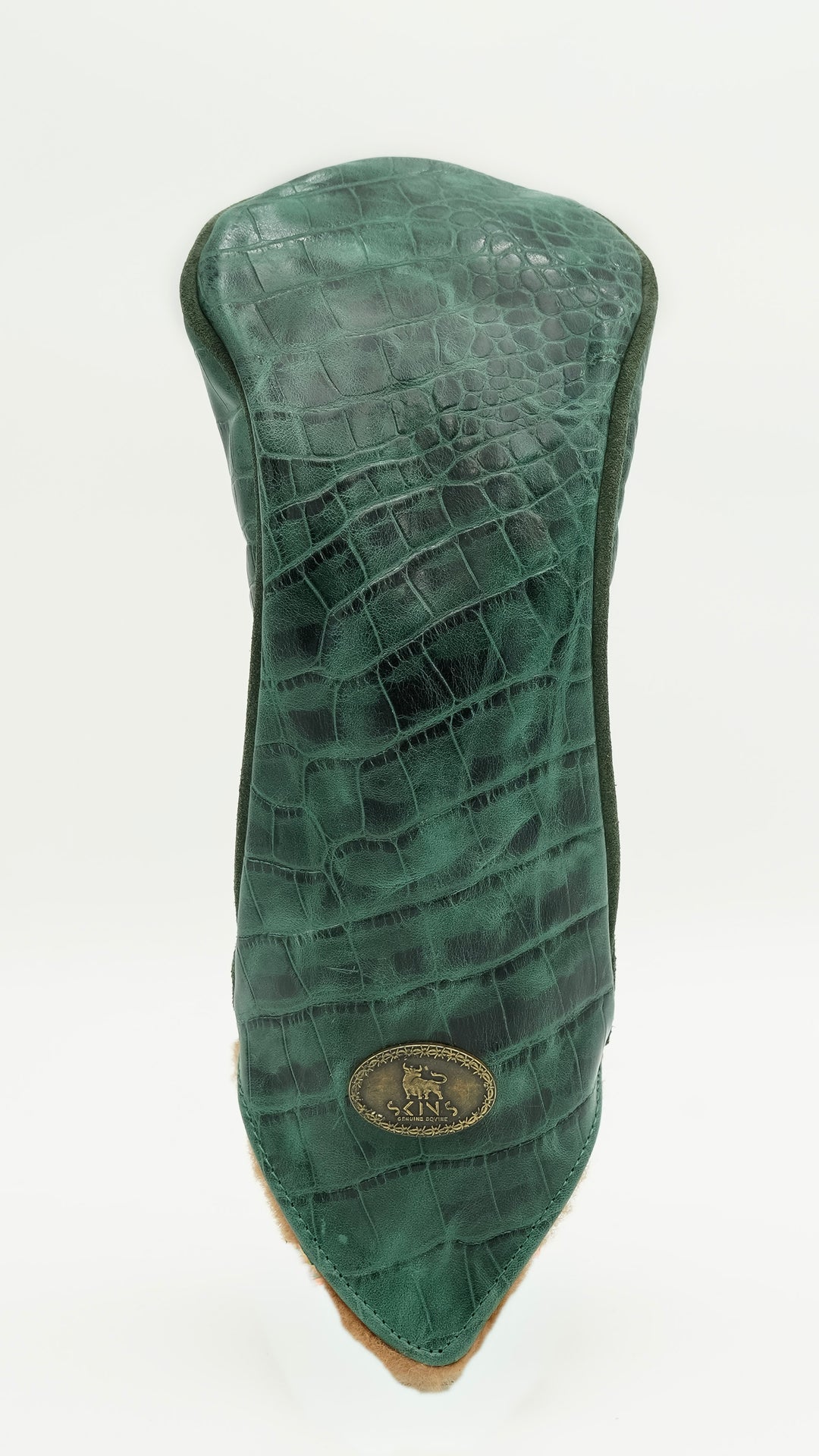 A green crocodile-embossed leather golf club headcover with a pointed tip and a gold-toned circular logo badge near the base, shown against a plain white background.