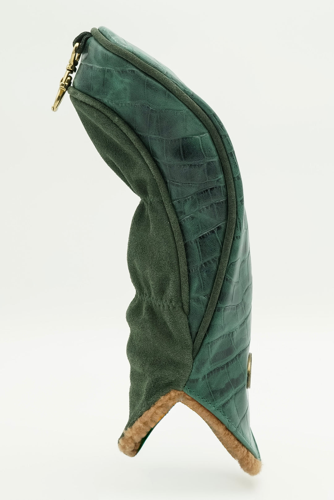 A dark green quilted leather boot cover with a gold zipper and a tan suede lining, shown from a side profile on a white background.