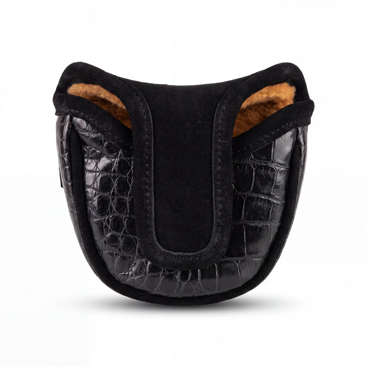 Black crocodile-embossed leather pouch with a soft black suede center panel and tan faux-fur lining, shown on a white background.