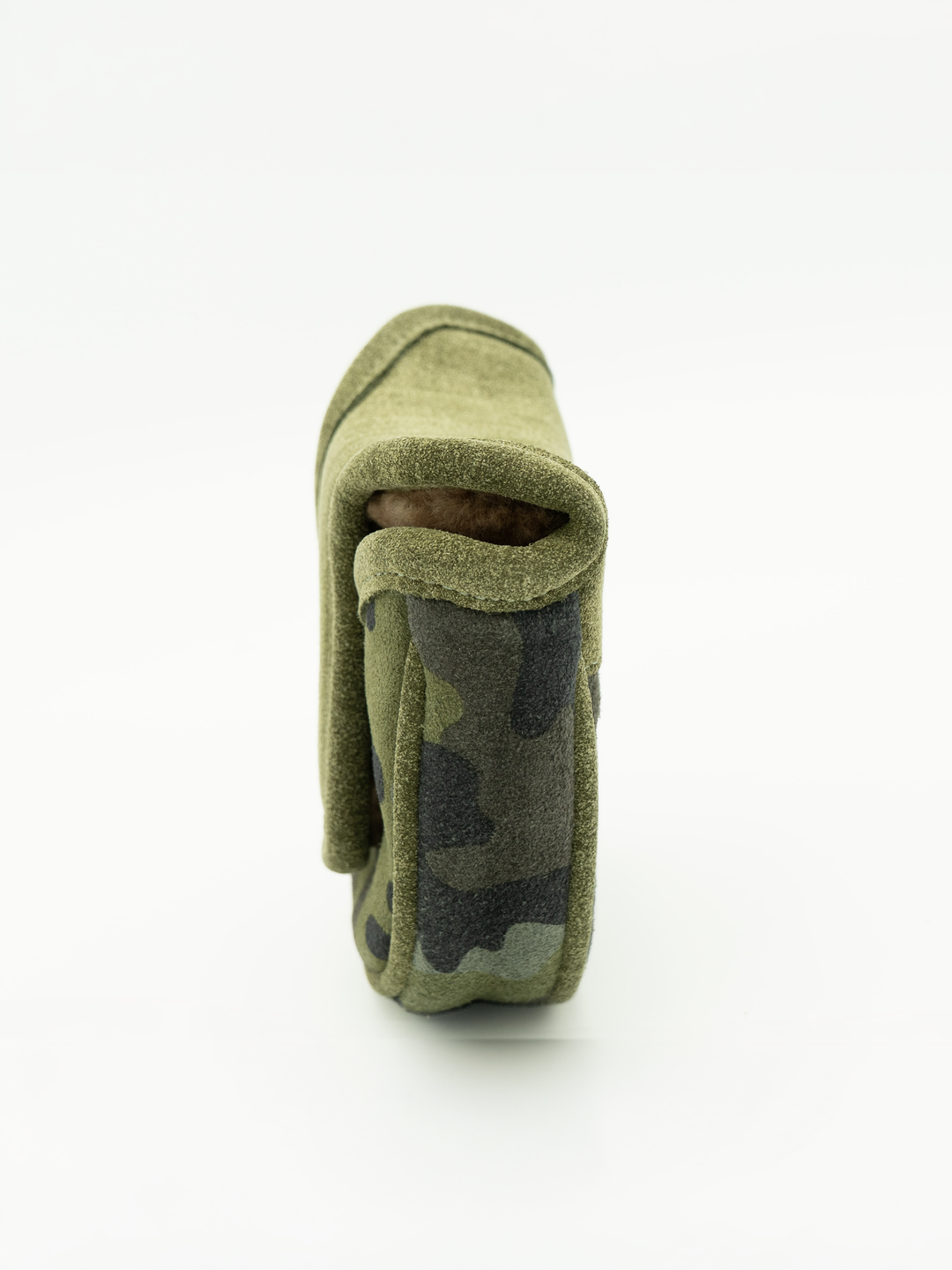 A close-up side view of a small olive green camouflage fabric pouch or sleeve on a clean white background.