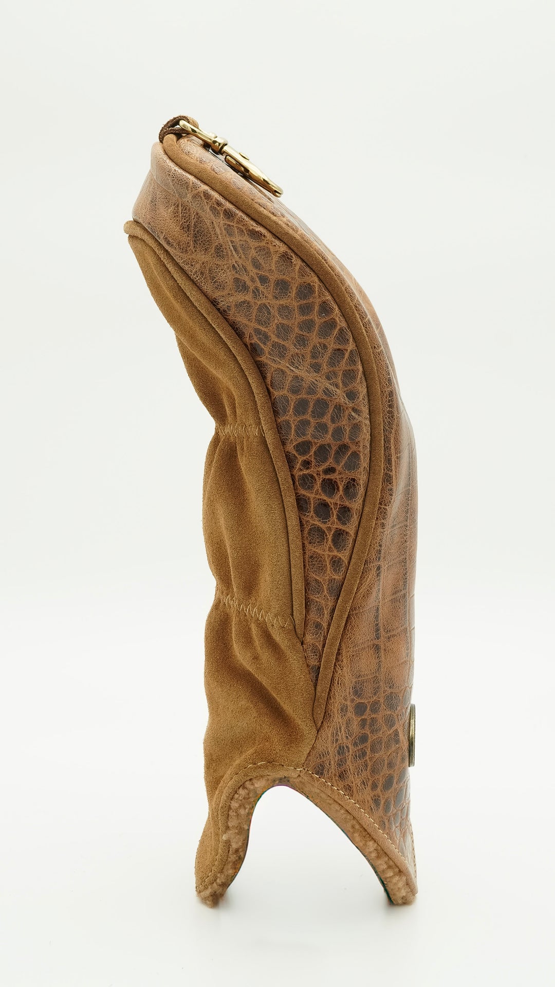 A tan leather boot cover with a crocodile-embossed pattern and a gold-tone zipper, shown from the side on a white background.